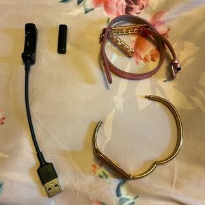 Fitbit flex 2 with two rose gold bands and charger. In good condition.